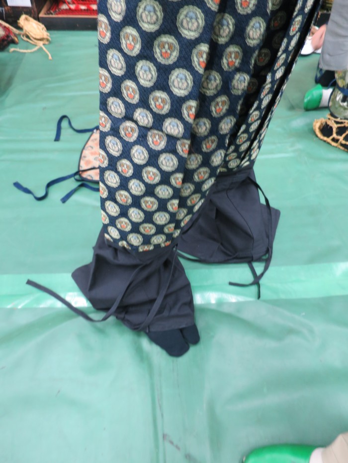 The pants will be covered with the blue cotton which is preparation for the leg protector added on later. 